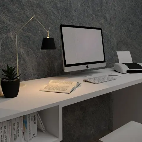 3D-rendered study desk setup with a white floating desk, iMac, brass desk lamp, and open shelving against a dark stone-textured wall.