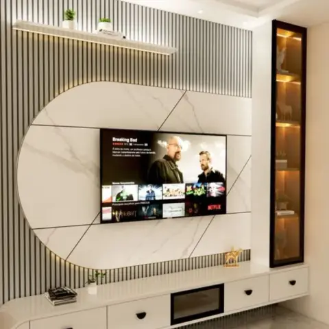 3D-rendered TV feature wall with fluted grey panelling framing a circular marble-effect medallion behind the screen, a backlit display niche