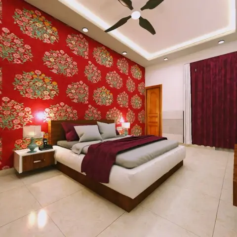 A bedroom headboard wall in red Mughal-floral block-print wallpaper, with floating walnut nightstands