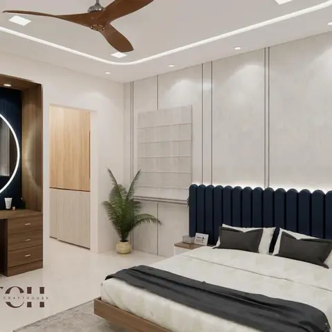 A bedroom render with a tall channel-tufted navy headboard, an illuminated round LED mirror over a matching fluted navy dressing nook