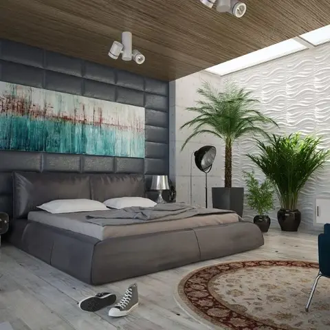 A bedroom with a black leather tufted-panel headboard wall hung with an abstract painting, a raw concrete side wall, a sculptural white wavy wall panel