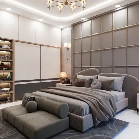 A bedroom with a curved upholstered bed set against a gold-trimmed grid-panelled wall, a sputnik chandelier overhead