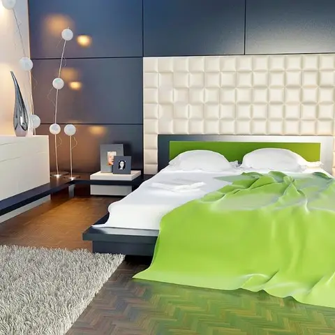 A bedroom with a tufted cream leather headboard against a dark panelled wall, a bright green bedspread and matching bench ottoman