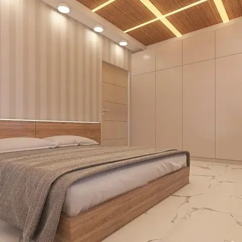 A bedroom with a wood-panelled bed against striped wallpaper, a full-height beige wardrobe wall, a wood slat ceiling with diagonal light coves