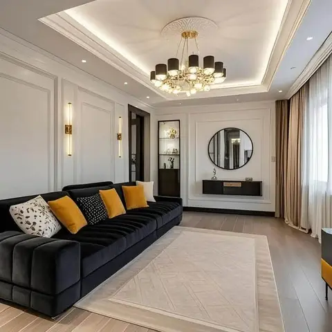 A black channel-tufted velvet sofa with mustard cushions sits under a tiered POP ceiling and an ornate drum chandelier