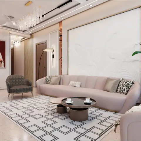 A curved blush-pink sofa faces a round two-tier coffee table in front of a large sculpted white botanical-relief wall panel with a gold frame.