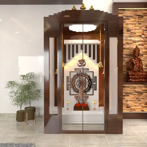 A dark wood glass-fronted pooja unit with hanging brass bells and a Sri Yantra panel stands beside a stacked-stone wall niche with a Buddha statue and globe