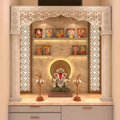 A dedicated pooja unit with a carved white jaali arch and pillars, a backlit textured stone wall with tiered idol shelves