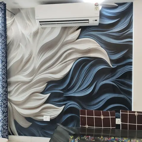 A dining nook with a dramatic blue-and-white wave-pattern wallpaper mural behind a wall-mounted AC unit, and a glass-top dining table in the foreground.