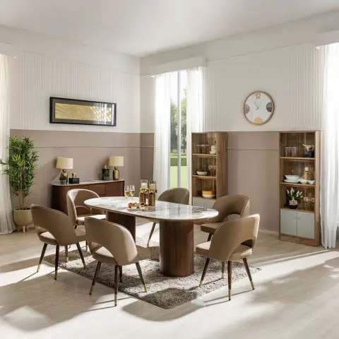 A dining room with an oval marble-top table on a curved walnut pedestal, six beige curved-back chairs with brass legs