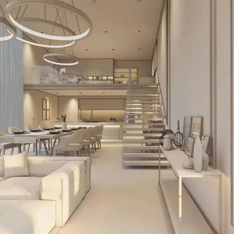 A double-height open-plan home showing a cream living-dining-kitchen layout beneath a mezzanine