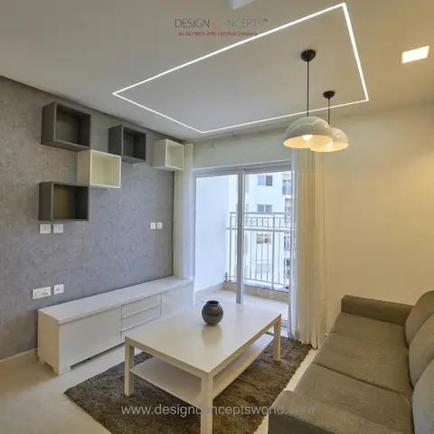 A grey-toned living room with a floating white TV console under a square LED ceiling profile, dome pendant lights over the coffee table