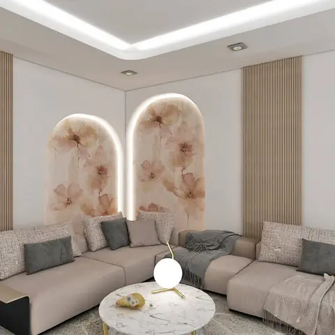A living room corner with fluted wood wall panelling flanking two arched, backlit floral-wallpaper niches, a beige sectional sofa