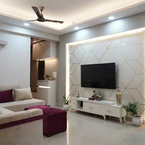 A living room with a backlit geometric gold-line feature wall behind the TV, a floating white TV console