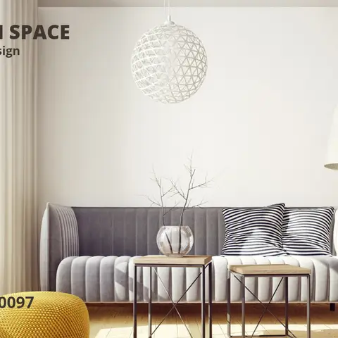 A living room with a grey channel-tufted sofa, black-and-white striped pillows, a woven sphere pendant light