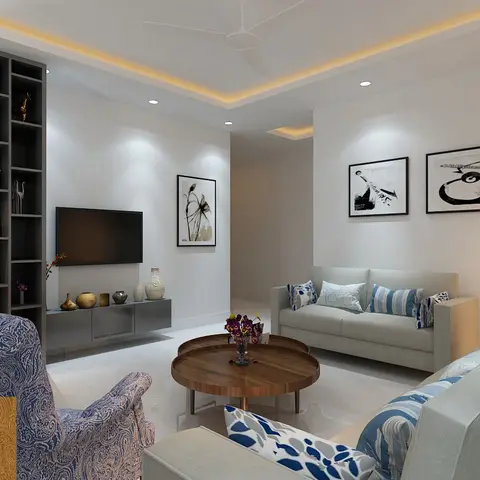 A living room with a grey open-shelf TV console, three black-and-white framed prints beside clustered glass pendant lights