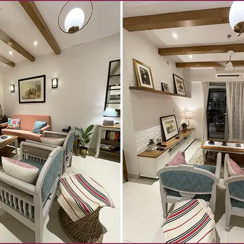 A living room with a peach sofa and blue cane-back armchairs around a wood coffee table