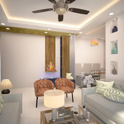 A living room with grey tufted sofas and rust-patterned armchairs facing a wood-clad pooja niche housing a Ganesha idol