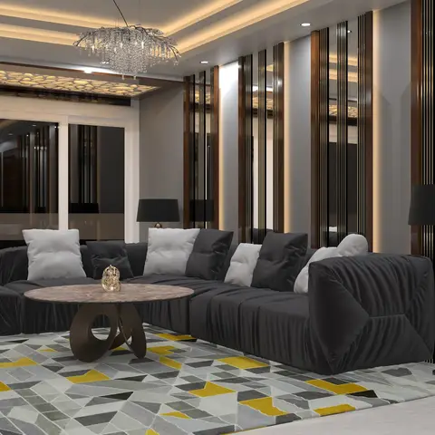 A luxury living room with a dark grey sectional sofa, a round marble coffee table, a geometric yellow-and-grey rug