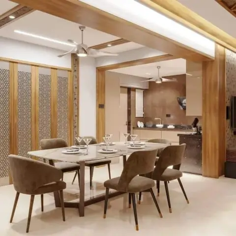 A marble-top six-seater with olive velvet chairs on brass-tipped legs, set under a gypsum ceiling gridded with teak-finish beams and recessed linear profile