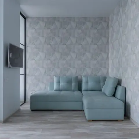 A mint-green corner sofa against a grey geometric-patterned feature wall, with a glass-partitioned bedroom visible alongside.