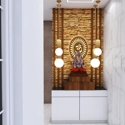 A pooja nook with a stacked stone feature wall centred on a carved wood Om medallion above a Ganesha idol