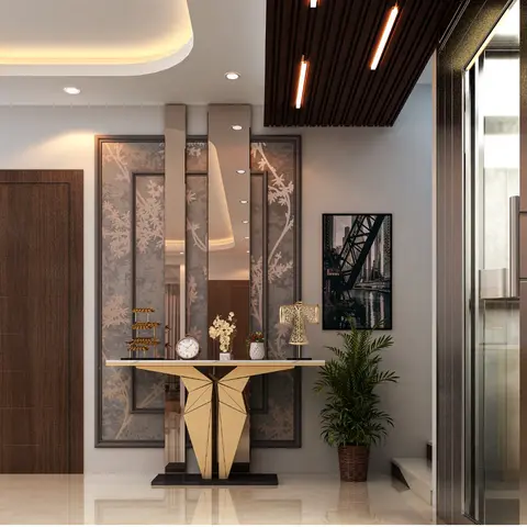 A private residence entrance foyer with a sculptural gold-based console table below a mirrored floral-panel wall, a wood-slat cove-lit ceiling drop