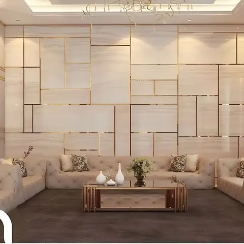 A rendered majlis-style living room with U-shaped tufted beige seating around a low brass-trimmed coffee table