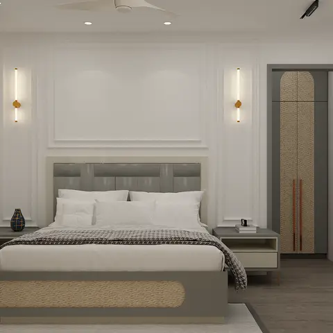 A symmetric bedroom with a grey-and-cane bed flanked by matching nightstands and twin wall sconces