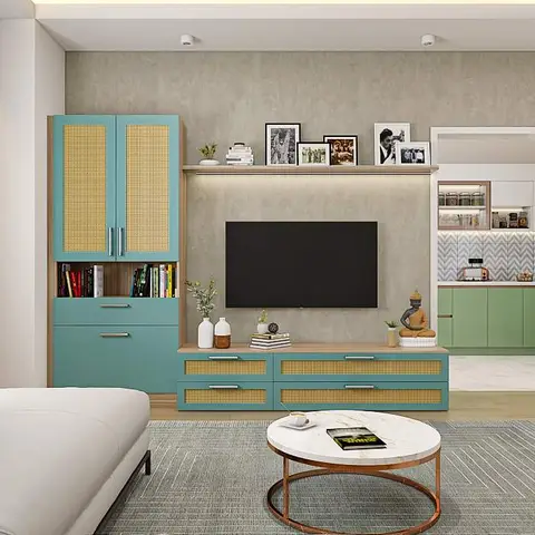 A teal-and-cane crockery unit and matching TV console styled with framed photos and a Buddha statue, against a textured stone-look accent wall.