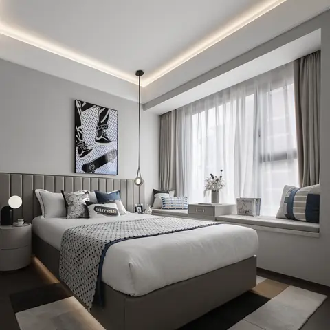 A teen bedroom with a channel-tufted grey headboard, skateboard-themed pop art, and a built-in bay-window seat behind layered sheer and blackout curtains.