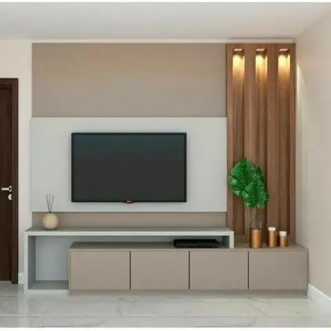 A two-tone mauve and white TV panel with a backlit fluted wood accent strip beside a low storage console with an open display cubby