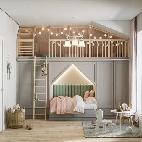 A whimsical kids bedroom with a house-shaped bed nook with green tufted headboard, string lights, and a ladder up to a loft play area above