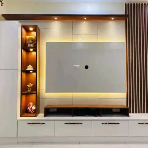 A white gloss TV unit wall with a backlit display niche and a dark fluted-wood slat accent column beside the screen recess.