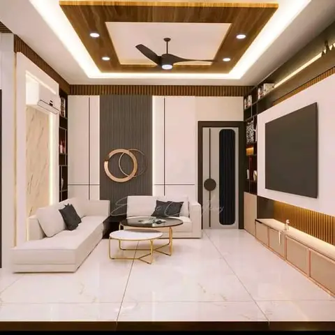 A white L-shaped sofa faces a fluted TV wall with black display shelving, under a stepped wood-panel false ceiling with cove lighting and a round