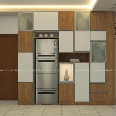 A wood-and-white crockery unit with glass-front cabinets and lit display niches houses a built-in refrigerator against a dining feature wall.