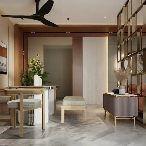 An open-plan dining and living area divided by a brass-framed lattice screen, with wood panelling, marble flooring, and a styled console vignette.