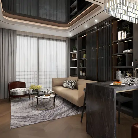 An open-plan living corner with a beige sofa, black-and-white nested coffee tables and a marbled rug beneath a curved cove-lit ceiling