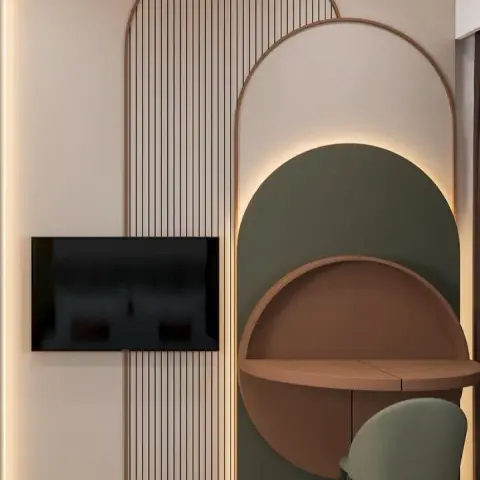 Arched fluted panel wall facing the foot of a houndstooth-covered bed, with the TV on the beige flute and a round rust-brown wall-hung dresser inset into a