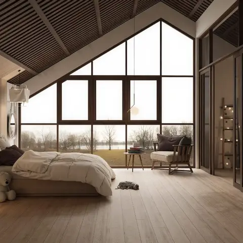Attic bedroom rendered under a dark timber-batten gable ceiling, with a triangular full-height window wall looking over a bare winter lake and two linen box