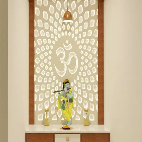 Backlit jaali wall panel with an Om motif cutout above a Krishna idol, a wood-and-marble pooja cabinet below flanked by brass diyas