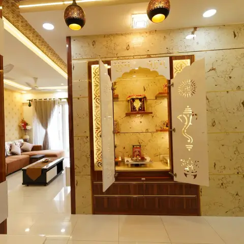 Backlit onyx-look pooja niche with CNC-cut Ganesha and diya jaali shutters under 'Shubh Labh' lettering