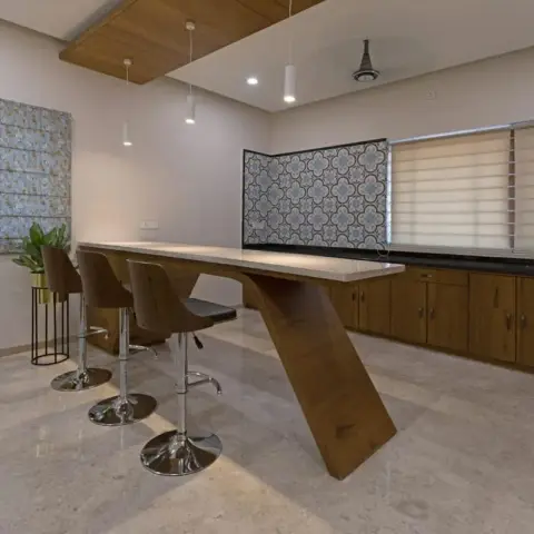 Bar-height breakfast counter on a single cantilevered teak leg with three swivel stools