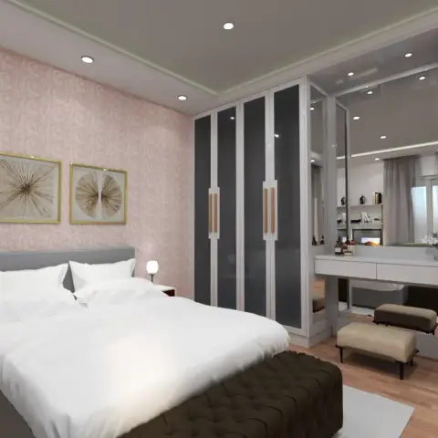 Basic render of a bedroom with blush swirl-patterned wallpaper behind a grey upholstered bed, two gold-framed sunburst prints
