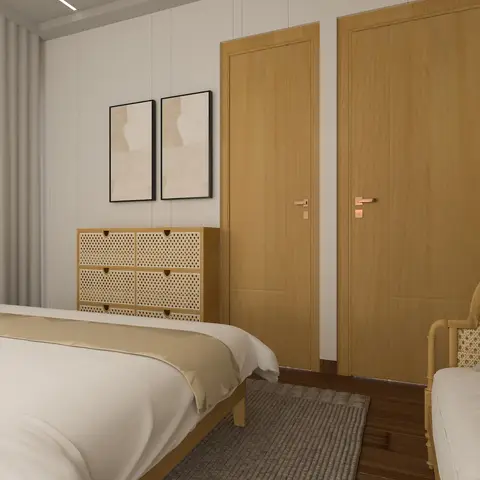 Bedroom corner in oak and cane, with a six-drawer cane-fronted chest under a pair of matching beige abstract prints