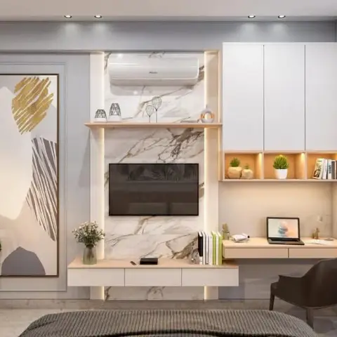 Bedroom feature wall seen from the foot of the bed: a veined white marble TV panel outlined in LED profile light