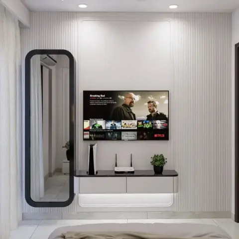 Bedroom TV wall in fluted white panelling with a rounded-rectangle reveal routed around the screen, a black-framed full-height mirror at left