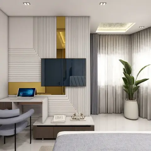 Bedroom TV wall of stepped white grooved panels broken by brass mirror inserts, with a built-in white study wing folding off the same wall towards a