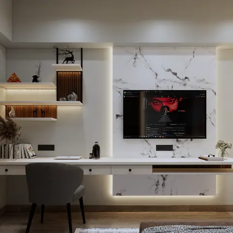 Bedroom wall combining a white marble-slab TV panel on a backlit reveal with a long floating desk that runs into it