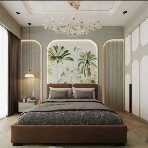 Bedroom where a backlit arched panel carries a hand-painted palm mural behind a brown leatherette bed, flanked by fluted sage arches